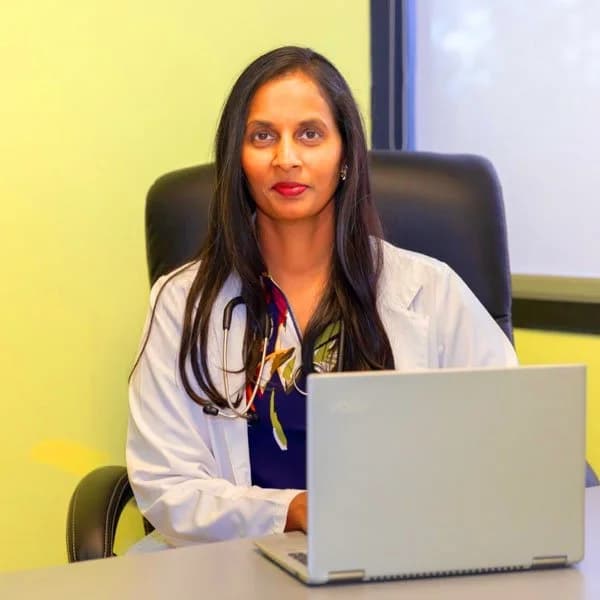 Dr. Gayatri Siram, MD, at her desk in the Boca Raton office