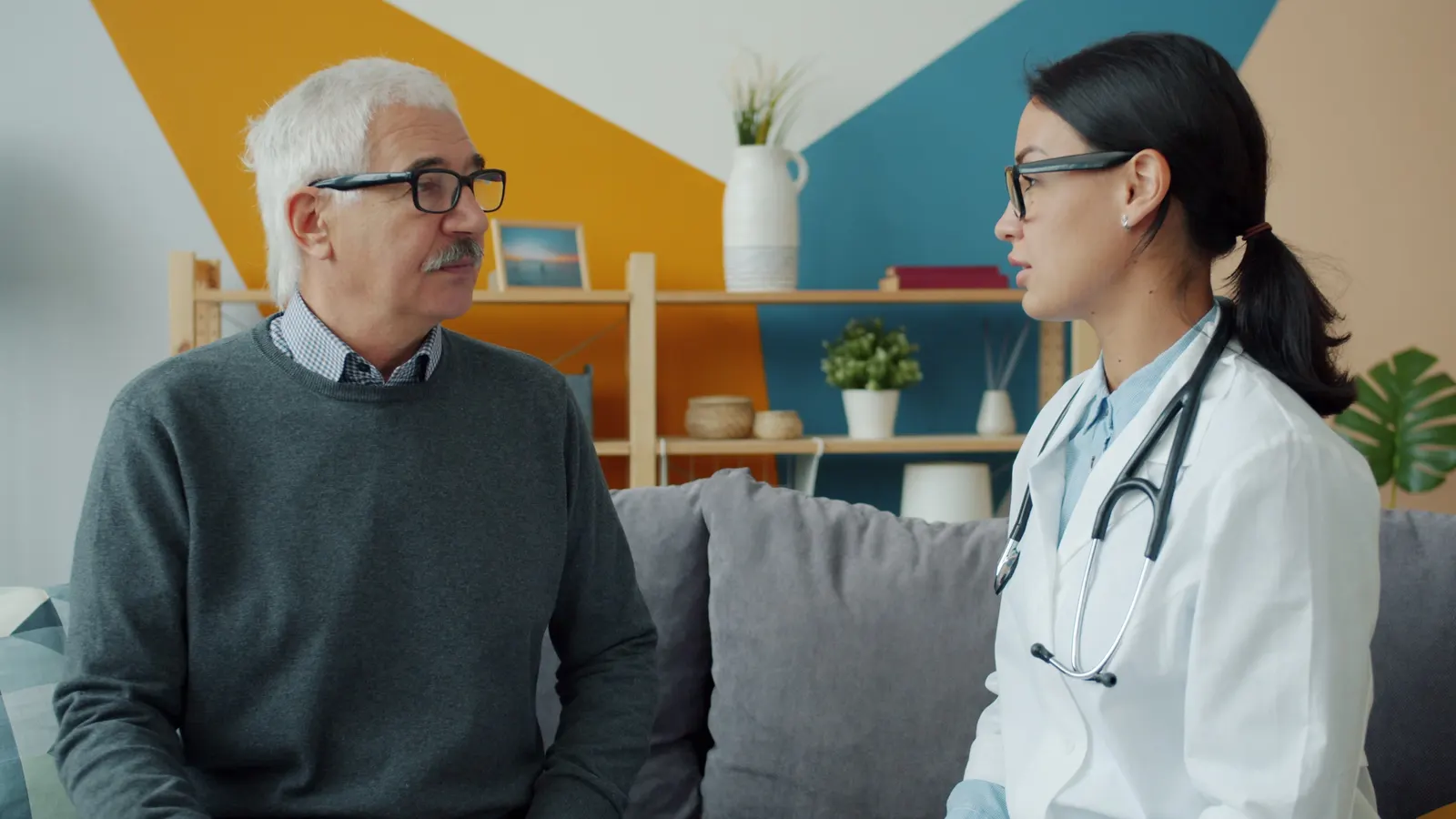 A physician talking with an older patient during a wellness visit
