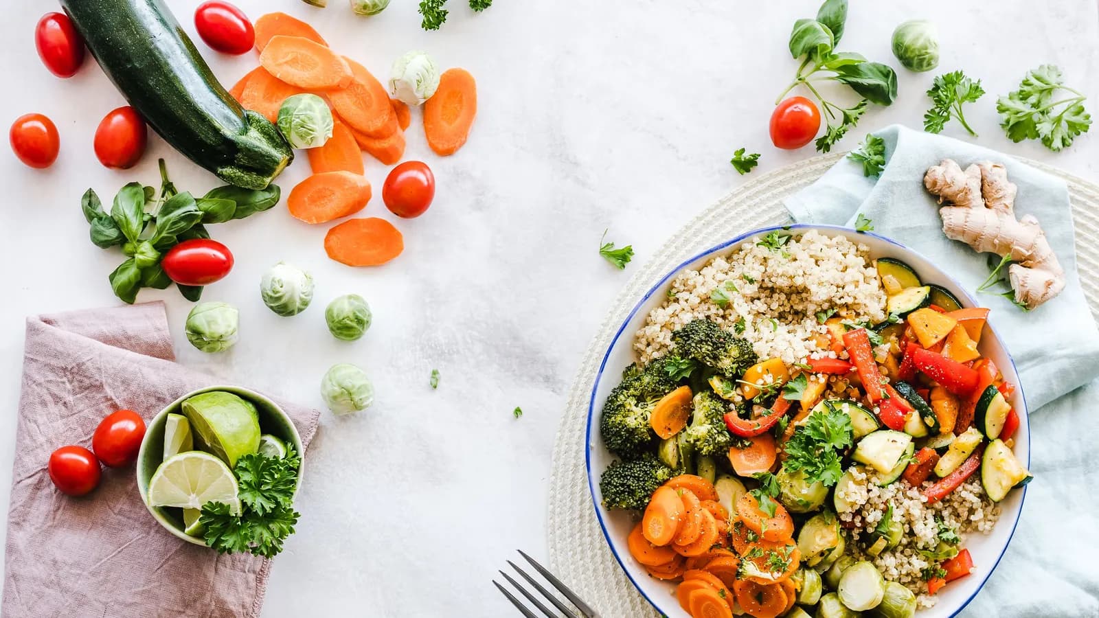 Fresh vegetables and whole foods arranged on a kitchen counter